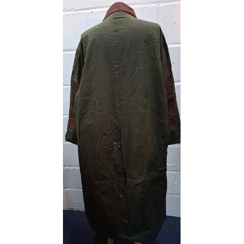 3 - Mulberry- A gents green wax cotton drovers coat having a brown leather collar and elbow pads and tar... 