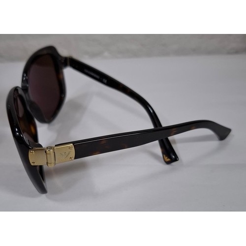 30 - Guerlain and Emporio Armani- A pair of vintage Armani brown faux tortoiseshell prescription sunglass... 