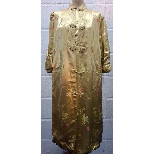 55 - Four late 20th Century Chinese robes to include a gold satin calf length gown having machine embroid... 