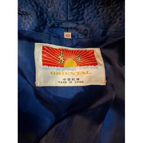 55 - Four late 20th Century Chinese robes to include a gold satin calf length gown having machine embroid... 