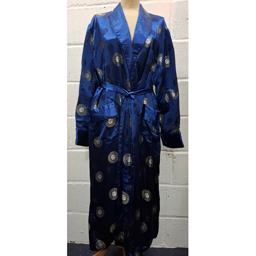 55 - Four late 20th Century Chinese robes to include a gold satin calf length gown having machine embroid... 