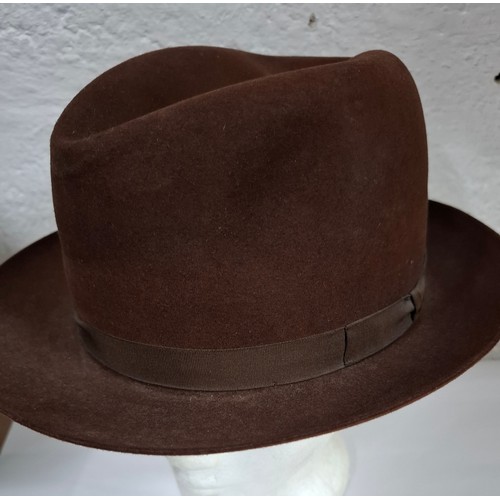 56 - Hats, table linen and throws comprising late 20th Century Jaeger ladies hats, a Bermona Trend black ... 