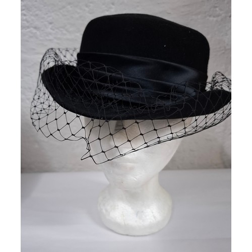 56 - Hats, table linen and throws comprising late 20th Century Jaeger ladies hats, a Bermona Trend black ... 