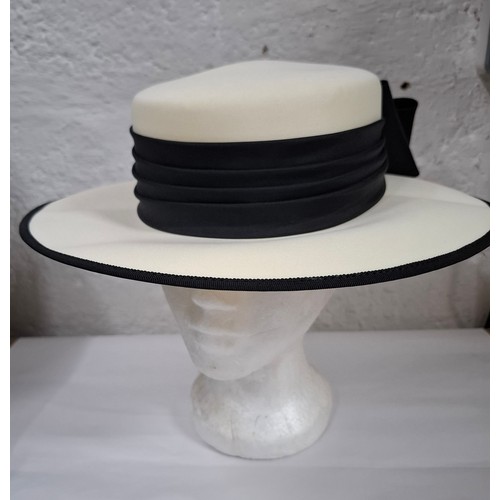 56 - Hats, table linen and throws comprising late 20th Century Jaeger ladies hats, a Bermona Trend black ... 