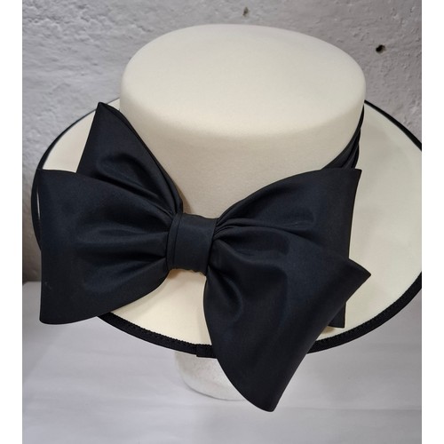 56 - Hats, table linen and throws comprising late 20th Century Jaeger ladies hats, a Bermona Trend black ... 