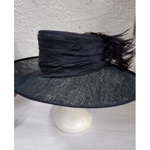 56 - Hats, table linen and throws comprising late 20th Century Jaeger ladies hats, a Bermona Trend black ... 