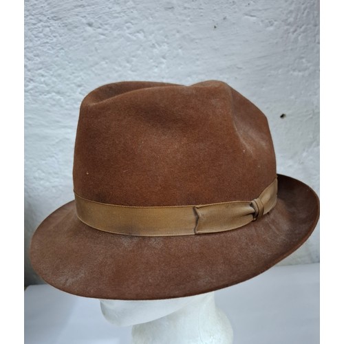 56 - Hats, table linen and throws comprising late 20th Century Jaeger ladies hats, a Bermona Trend black ... 