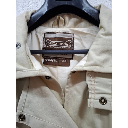 47 - Driza-Bone- An un-worn natural moleskin riding coat having original tags intact, size 6 on label (ap... 