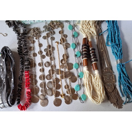 37 - Vintage necklaces to include an ethnic amber coloured bead necklace, a coral multi strand necklace a... 