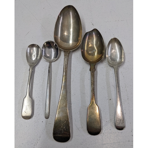 A selection of silver spoons to include a Georgian table spoon ...