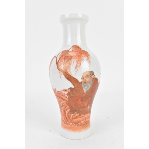 112 - A Chinese porcelain vase, 20th century, of baluster form with flared neck, decorated in iron-red ena... 
