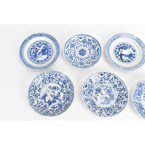 13 - A mixed group of Chinese blue and white porcelain dishes, Qing dynasty, including examples painted w... 