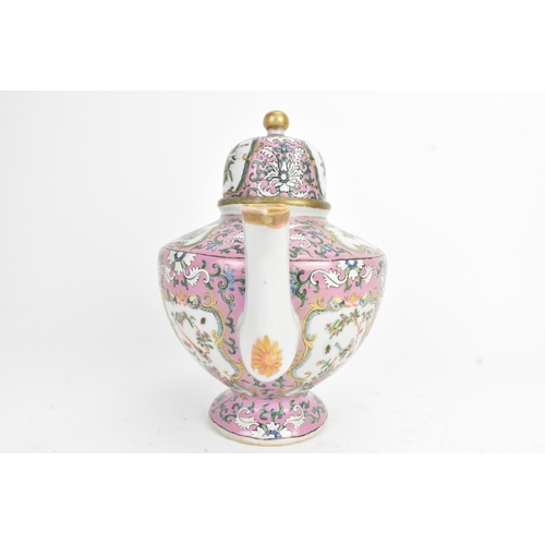 16 - A Chinese Canton famille rose teapot, late 19th century, of baluster form, enamelled with shaped pan... 