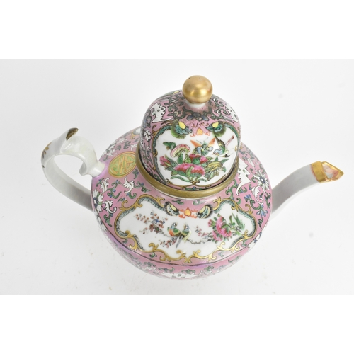 16 - A Chinese Canton famille rose teapot, late 19th century, of baluster form, enamelled with shaped pan... 