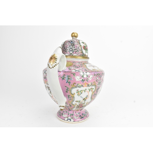 16 - A Chinese Canton famille rose teapot, late 19th century, of baluster form, enamelled with shaped pan... 