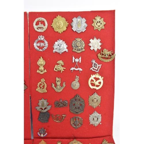 A collection of military cap badges, comprising six display boards ...
