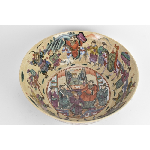 17 - A Chinese crackle glazed famille rose porcelain punch bowl, 19th century, decorated with continuous ... 