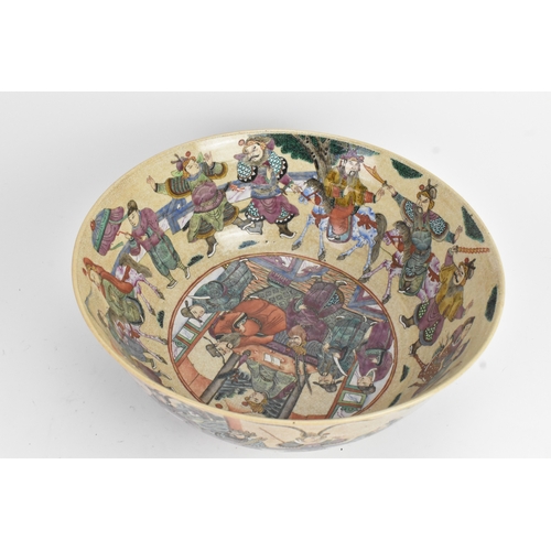 17 - A Chinese crackle glazed famille rose porcelain punch bowl, 19th century, decorated with continuous ... 