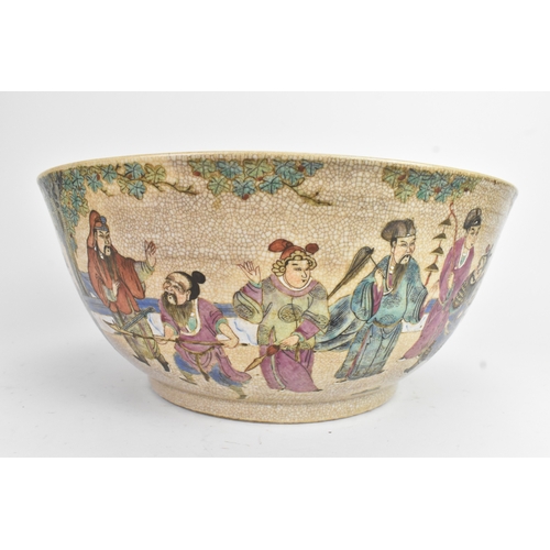 17 - A Chinese crackle glazed famille rose porcelain punch bowl, 19th century, decorated with continuous ... 