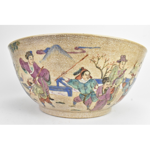 17 - A Chinese crackle glazed famille rose porcelain punch bowl, 19th century, decorated with continuous ... 