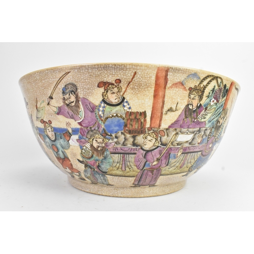 17 - A Chinese crackle glazed famille rose porcelain punch bowl, 19th century, decorated with continuous ... 