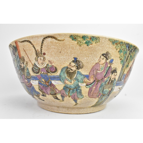17 - A Chinese crackle glazed famille rose porcelain punch bowl, 19th century, decorated with continuous ... 