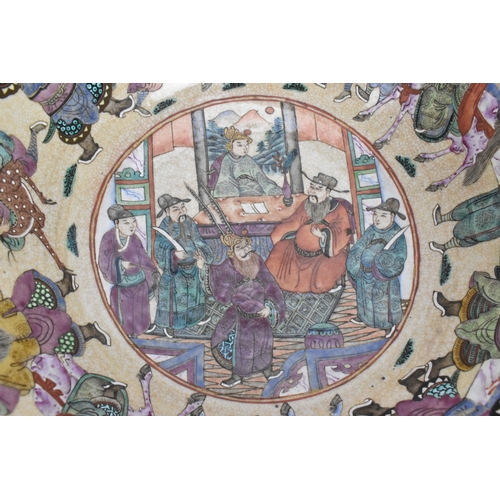 17 - A Chinese crackle glazed famille rose porcelain punch bowl, 19th century, decorated with continuous ... 