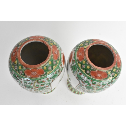 20 - A pair of 19th century Chinese famille vert vases in Kangxi style, of baluster form with elaborate p... 