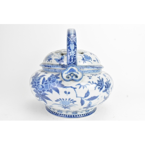 23 - A Japanese blue and white porcelain covered basket-form vessel, of globular form with domed pierced ... 