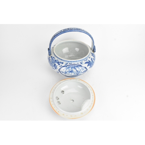 23 - A Japanese blue and white porcelain covered basket-form vessel, of globular form with domed pierced ... 
