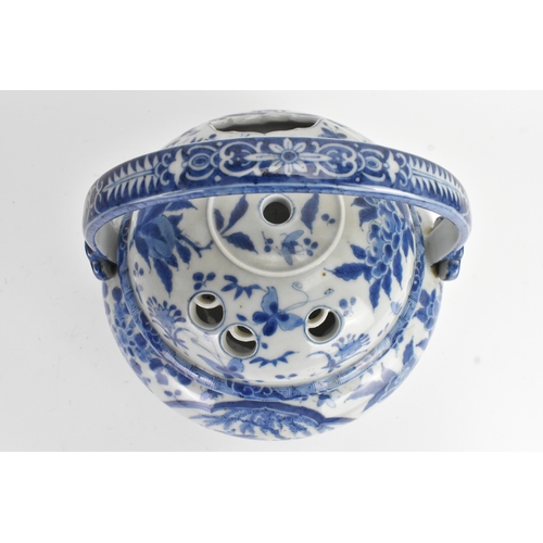 23 - A Japanese blue and white porcelain covered basket-form vessel, of globular form with domed pierced ... 