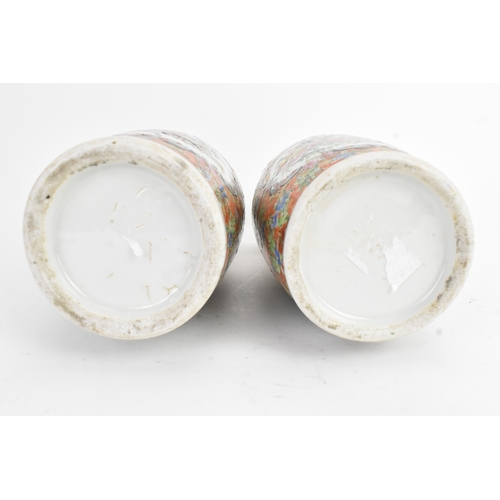 24 - A pair of Chinese export famille rose porcelain vases, late Qing dynasty, each with applied lion dog... 
