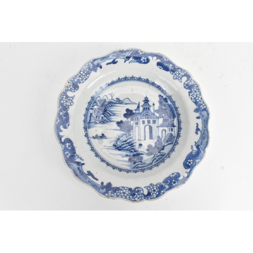 26 - A pair of Chinese blue and white porcelain dishes, Qianlong period, each decorated with river landsc... 