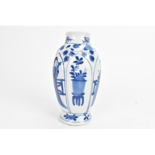 29 - A Chinese blue and white porcelain vase, Kangxi period, decorated with figures and flowers with pane... 
