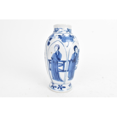 29 - A Chinese blue and white porcelain vase, Kangxi period, decorated with figures and flowers with pane... 