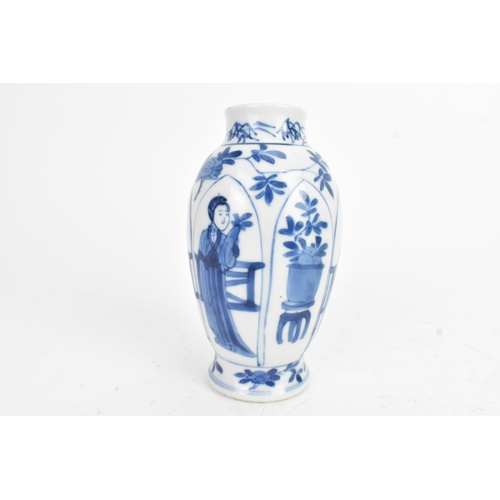 29 - A Chinese blue and white porcelain vase, Kangxi period, decorated with figures and flowers with pane... 
