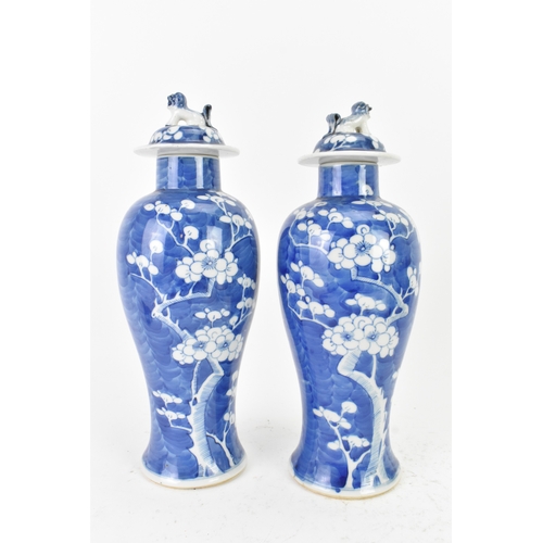 31 - A pair of Chinese blue and white porcelain Qing dynasty vases, late 19th century, each of baluster f... 