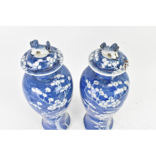 31 - A pair of Chinese blue and white porcelain Qing dynasty vases, late 19th century, each of baluster f... 