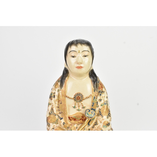 32 - A Japanese Satsuma figure group, early 20th century, modelled as Guanyin seated on a shi-shi lion, d... 