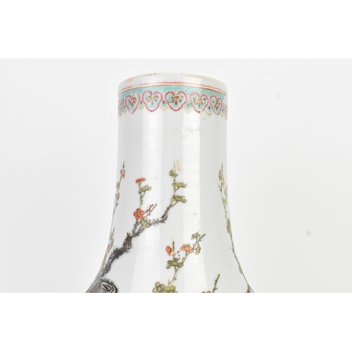 33 - A Chinese famille rose porcelain vase, late 19th/early 20th century, of pear-shaped form with a slen... 