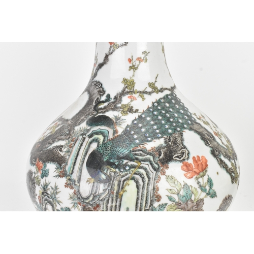 33 - A Chinese famille rose porcelain vase, late 19th/early 20th century, of pear-shaped form with a slen... 