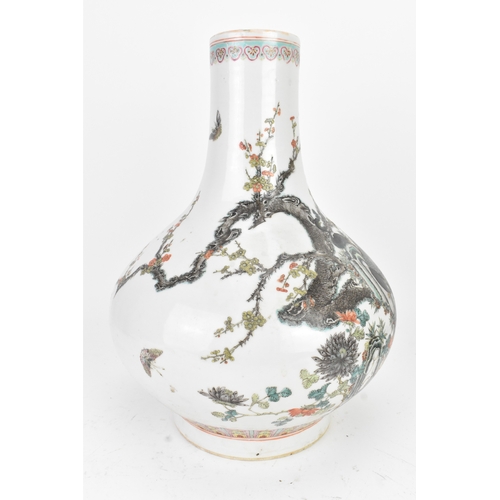 33 - A Chinese famille rose porcelain vase, late 19th/early 20th century, of pear-shaped form with a slen... 