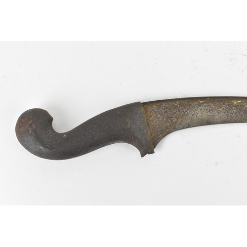 42 - A 19th century Indian dagger, having a curved single-edged blade decorated with traces of gilt inlay... 