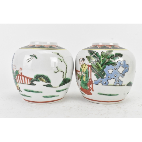 46 - A pair of Chinese famille verte ginger jars, 20th century, each decorated with figures in a continuo... 