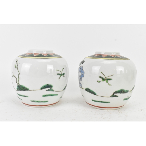46 - A pair of Chinese famille verte ginger jars, 20th century, each decorated with figures in a continuo... 