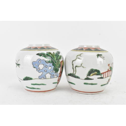 46 - A pair of Chinese famille verte ginger jars, 20th century, each decorated with figures in a continuo... 