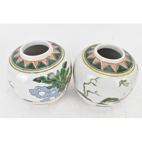 46 - A pair of Chinese famille verte ginger jars, 20th century, each decorated with figures in a continuo... 
