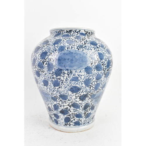 49 - A Chinese blue and white porcelain vase, 20th century, of ovoid form, decorated in the Kangxi style ... 