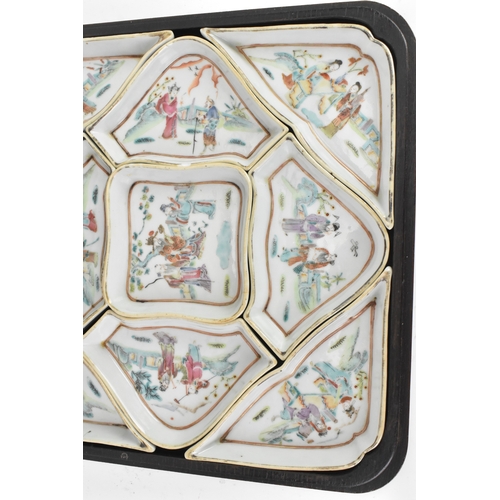 52 - A Chinese export famille rose porcelain sweetmeat set, late Qing dynasty, comprising a group of shap... 