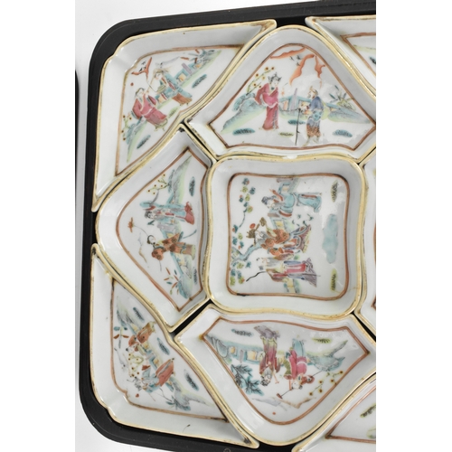 52 - A Chinese export famille rose porcelain sweetmeat set, late Qing dynasty, comprising a group of shap... 